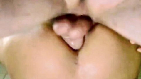 Close-up of wet shaved pussy with spread pink labia exposing moist vaginal entrance