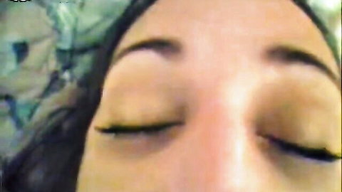 POV close-up of amateur long-haired girl's face with eyes closed and long lashes
