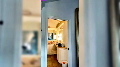 Lindsey Pelas peeking from nude October bathroom livestream
