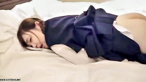 Petite pigtail Asian schoolgirl in uniform sleeps with skirt up, exposing ass