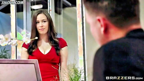 Busty brunette secretary in tight red dress teases boss with deep cleavage in office