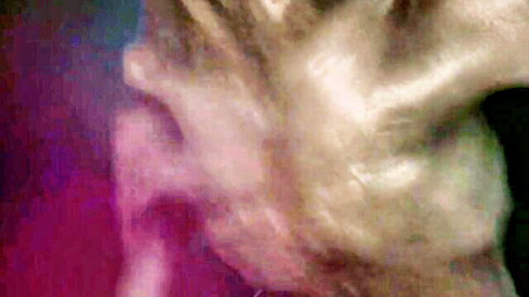 Blurry distorted pale face screaming in purple pink neon glow abstract art