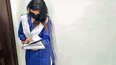 Sobia Nasir in blue salwar kameez, masked, holding notebook seductively