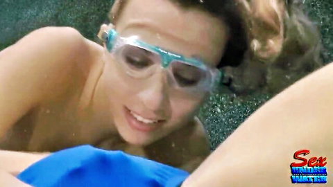 Blonde lesbian enjoying underwater sex with goggles and smile