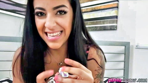 Smiling Latina brunette with tattoos teases anal toy insertion