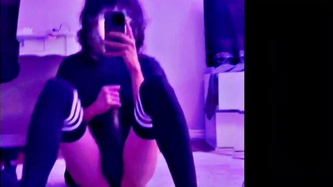 Kittykaz in Halloween mirror selfie, teasing with toy in Adidas top and thigh-highs