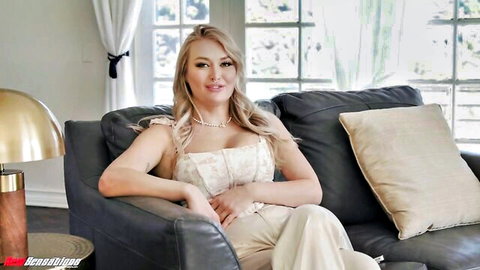Natalia Starr in low-cut white top showing cleavage, behind the scenes