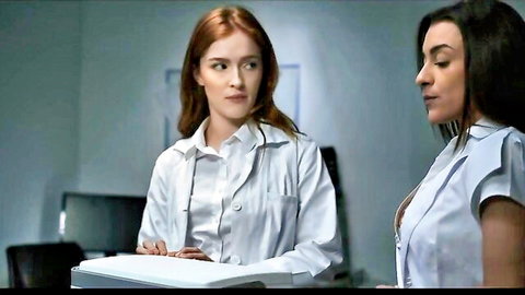 Sexy redhead and brunette nurses in tight white lab coats gazing in office