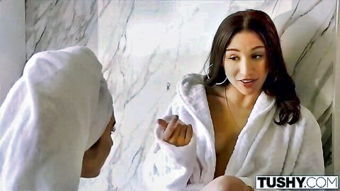 Two curvy brunettes in open white robes flash natural tits and cleavage in marble bathroom