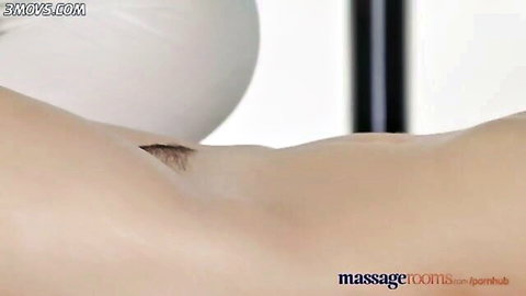 Oiled lesbian masseuse rubs and spreads nude babe's small bare ass during sensual massage