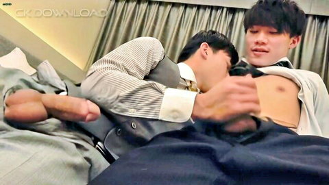 Two Asian men in suits having gay sex as coworkers