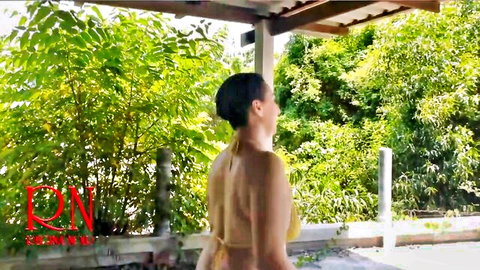 Topless Asian babe with bare back and sideboob struts outdoors in tiny yellow thong by bamboo