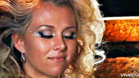 Jeanie Marie Sullivan's seductive blonde close-up in comic threesome