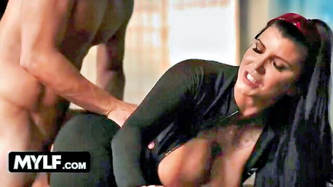 Muscular naked stud gropes busty brunette MILF's huge tits in unzipped black latex outfit