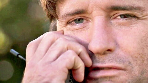 Emotional bearded man with green eyes talking intensely on phone closeup