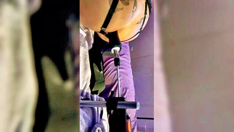 Woman in purple lingerie using sex toy in doggy style