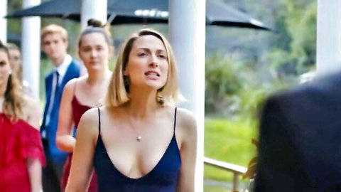 Brittany Hockley sexy cleavage in navy V-neck dress with Clare Griggs, Sarah-Louise Collidge at Malibu event
