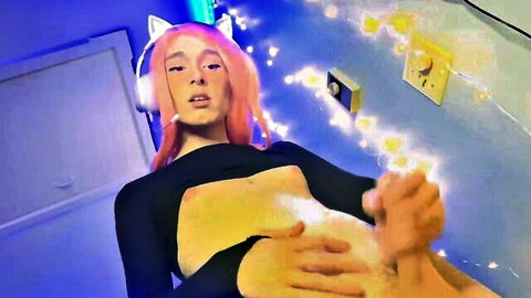 Rotten Pumpkin trans gamer girl in pink hair, cat ears, headphones, seductive pose