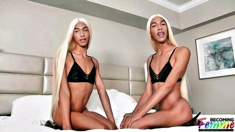 Twin blonde trans femboys sit bottomless on bed in black lace bras spreading legs exposing cocks
