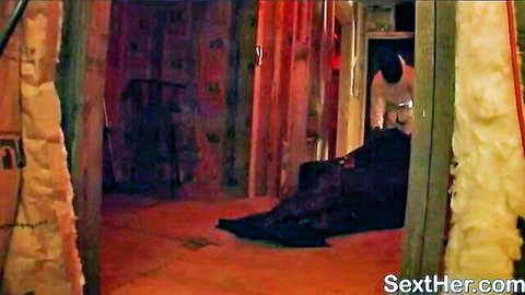 Sophie Dee in white top bending over in steamy adult scene