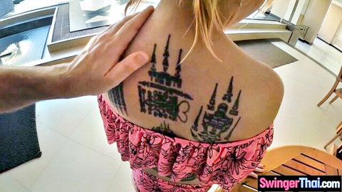 Tiny Thai MILF with Sak Yant tattoos, blonde hair, in pink swimsuit top