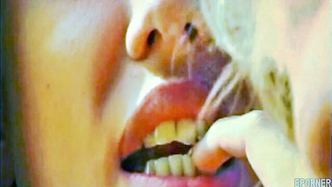 Blonde woman close-up lips and hand tease in retro lesbian style