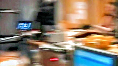 Blurry topless woman in French radio studio defiance scene