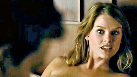Blonde babe topless with perky tits staring intensely surprised expression
