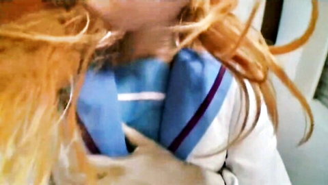 Fiery redhead nurse in tight blue uniform with messy hair close-up tease
