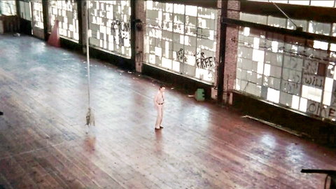 Vintage 1976 solo male in underwear posing in empty hall