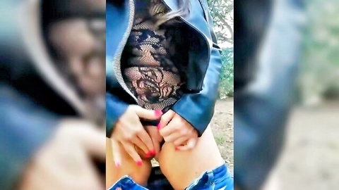 Amateur blonde exposing pussy and anus outdoors in woods, hand on genitals