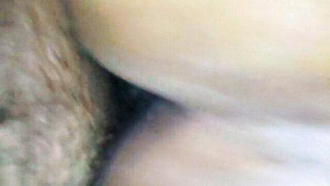 Blurry close-up of curvy Sahrawi woman's bare ass and thighs