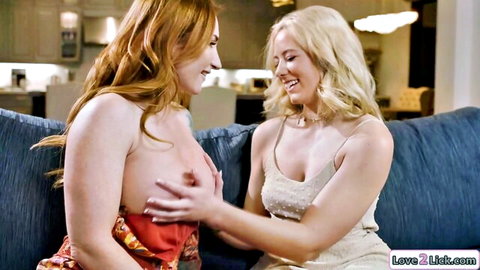 Busty redhead stepmom's breasts fondled by smiling blonde on couch