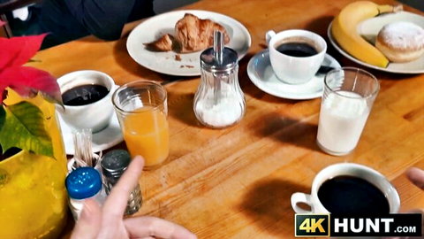 Charlotte Grey at cozy breakfast table with croissant, coffee, juice, and fruits