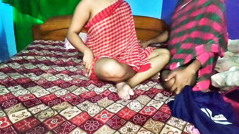 Curvy Indian Desi bhabhi in red sari spreads legs teasingly