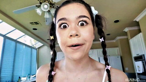 Brianna Arson wide-eyed in pigtails, teasing expression