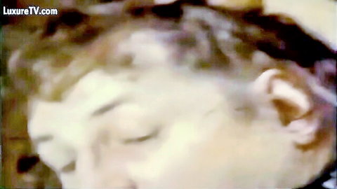 Vintage blurry close-up of woman's face in ecstasy