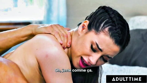 Ebony woman with braids cries in ecstasy as muscular man grips her nude shoulders tightly