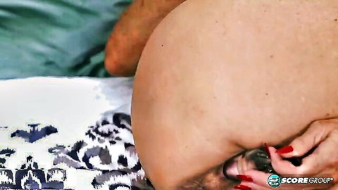Busty Sally lies back for intense tit play in bed