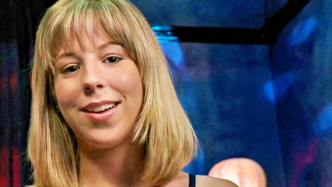 Smiling blonde teen babe with bangs in seductive closeup portrait