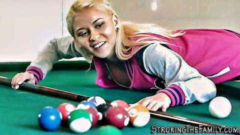 Busty blonde stepsister teasing over pool table in open varsity jacket