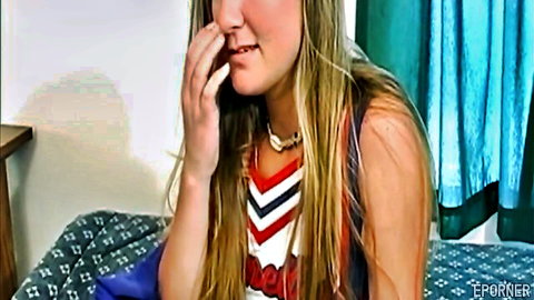 Aurora Snow in cheerleader outfit, teasing smile on casting couch
