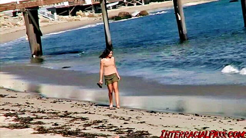 Kimber Troy topless on sunny beach in InterracialPass BBC scene