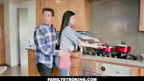 Curvy brunette MILF in apron hugged from behind by stepson in kitchen
