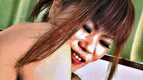 Close-up of Japanese woman with pigtails smiling in nude JAV thumbnail, bushy pussy focus