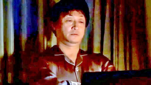 Mature Asian man in brown shirt, thoughtful expression, JAV thumbnail