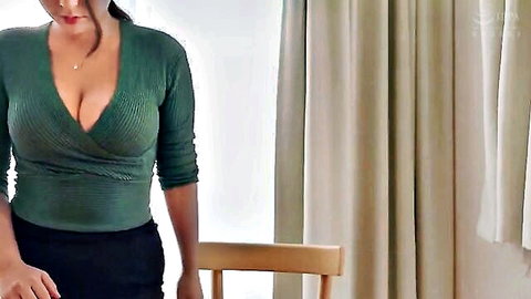 Yuri Honma in sexy green wrap blouse with deep cleavage
