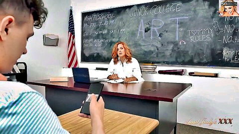 Andi James as mature redhead teacher with student in class