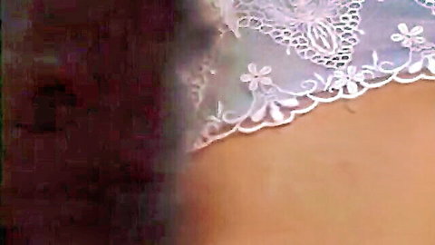 Close-up of sexy floral lace panties hugging East Asian woman's pussy mound