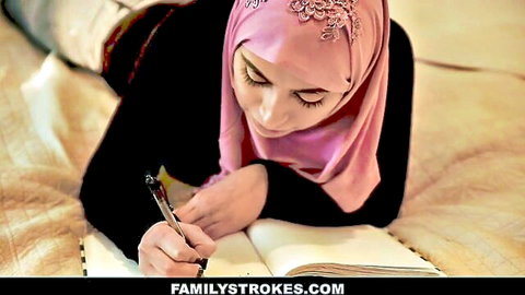 Ella Knox in pink hijab, busty beauty writing on bed